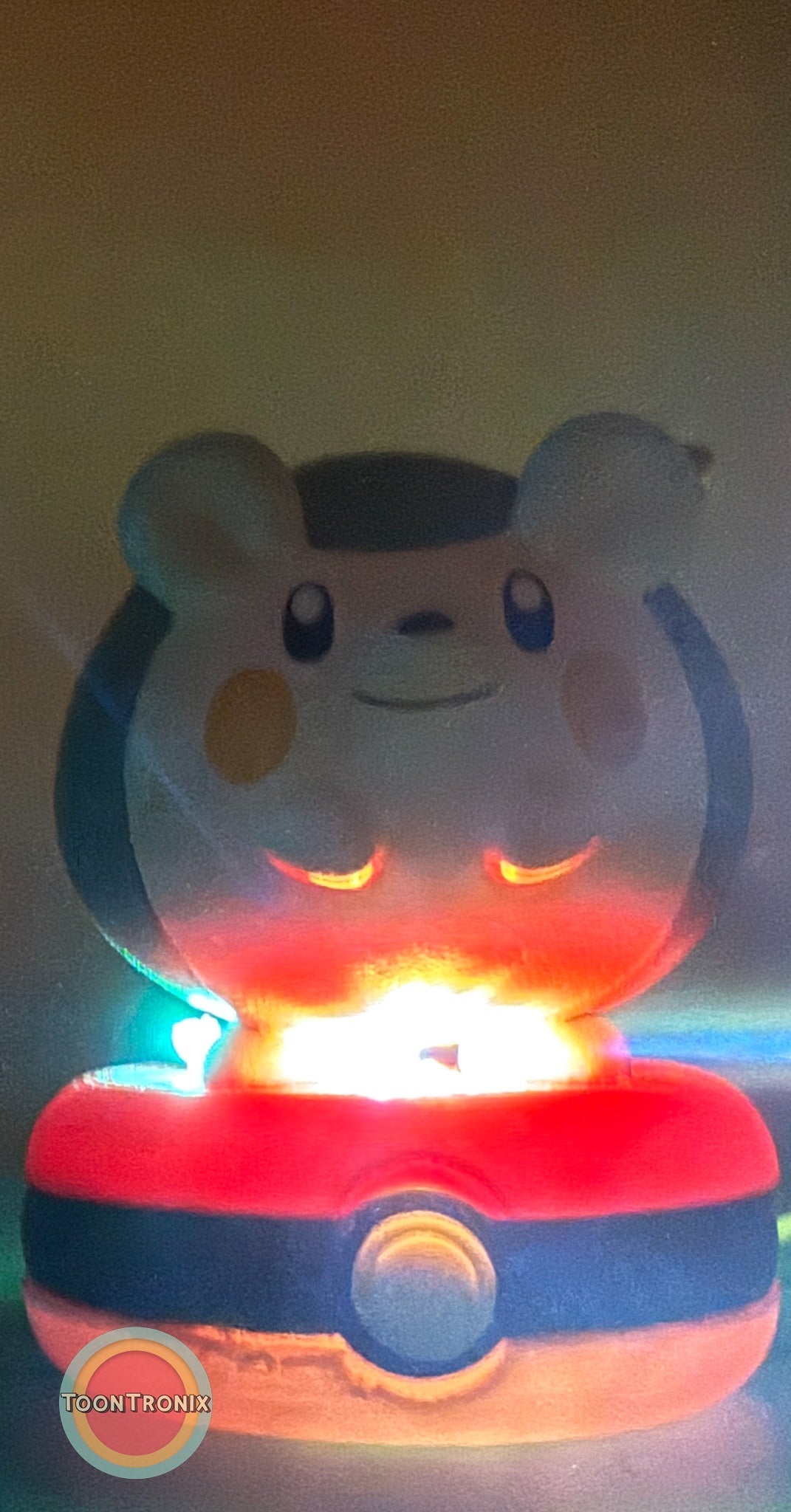 3" Togedemaru Pokemon Statue USB desk lamp glowing on a Pokeball base with colorful light accents