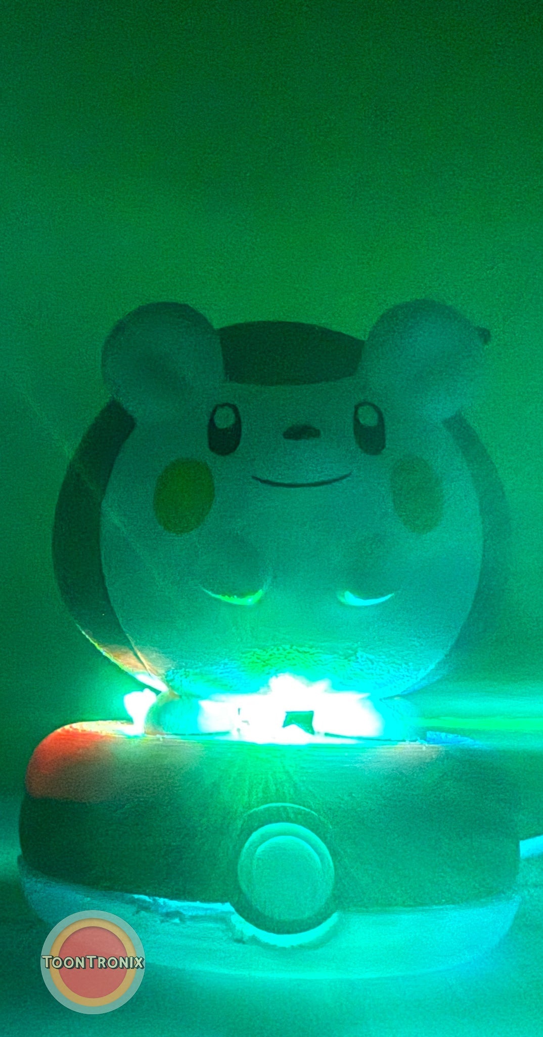 3" Togedemaru Pokemon statue USB desk lamp glowing green on a Pokeball base