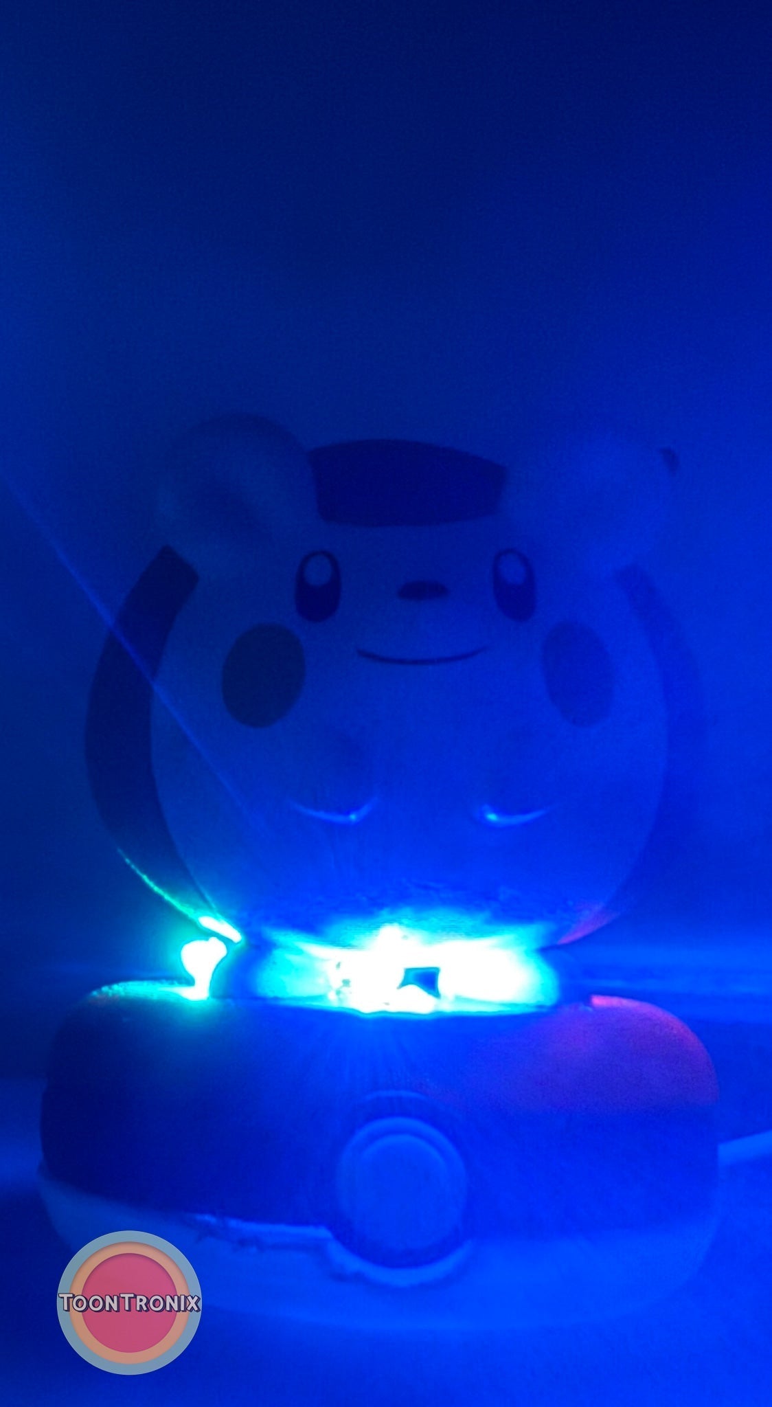 3" Togedemaru Pokemon Statue USB desk lamp glowing blue on a Pokeball base
