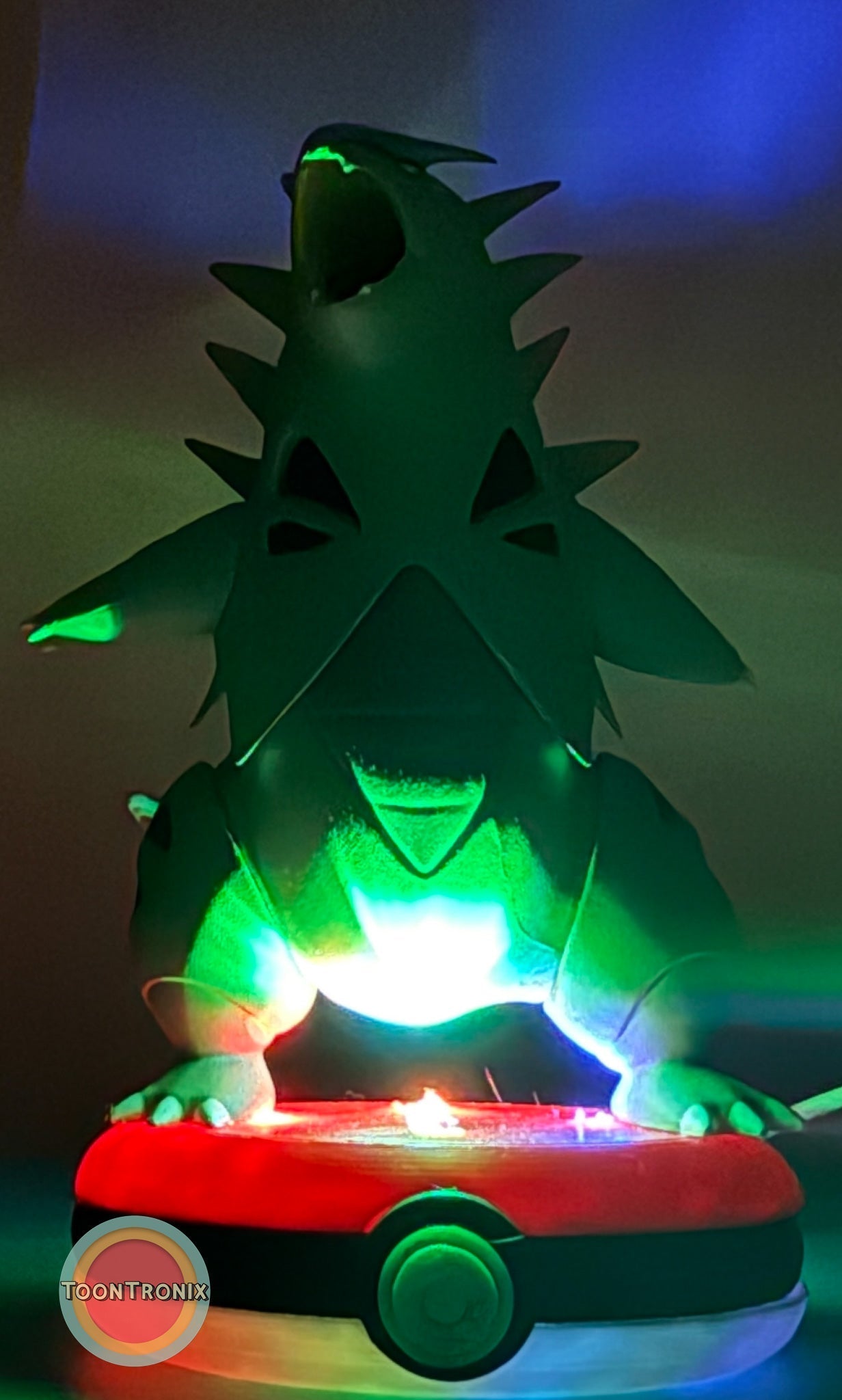 5" Tyranitar Desk Lamp glowing green on a Pokeball base with built-in USB cord