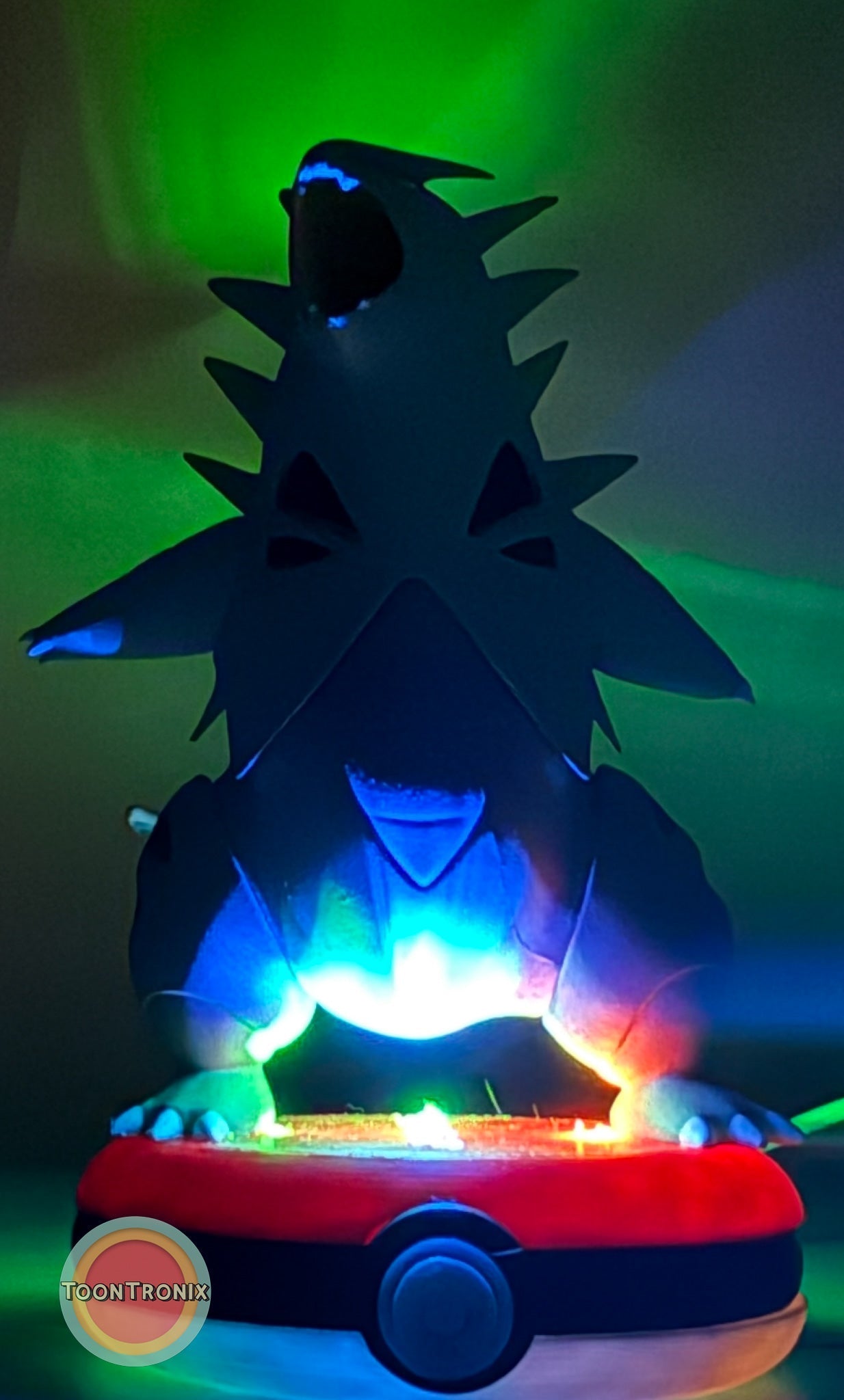 5" Tyranitar Pokemon statue desk lamp with USB cord and colorful LED lighting on a Pokeball base