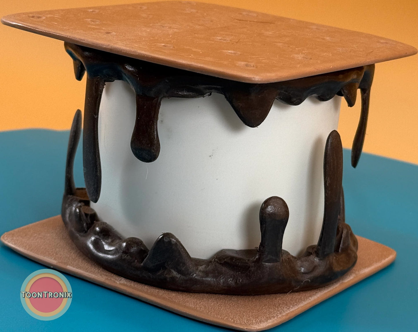 Smores desk lamp with melting chocolate and graham cracker design in retro cartoon style