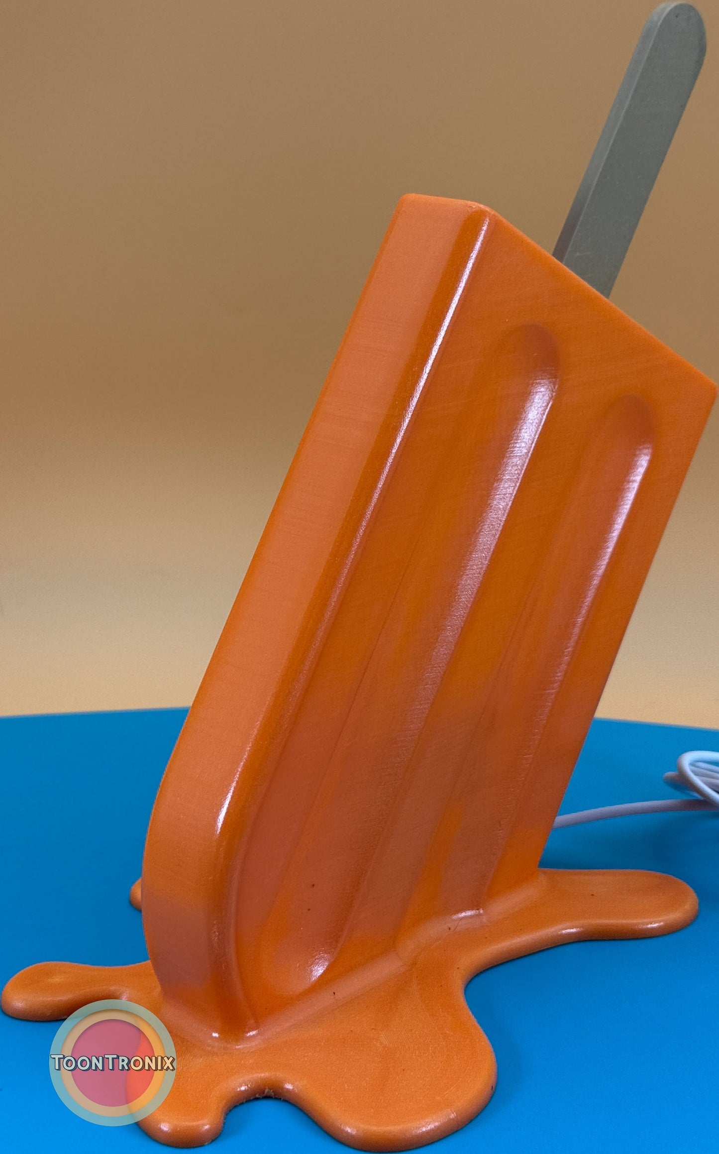 6" or 9" Popsicle desk lamp in retro orange design with melting base and built-in USB cord