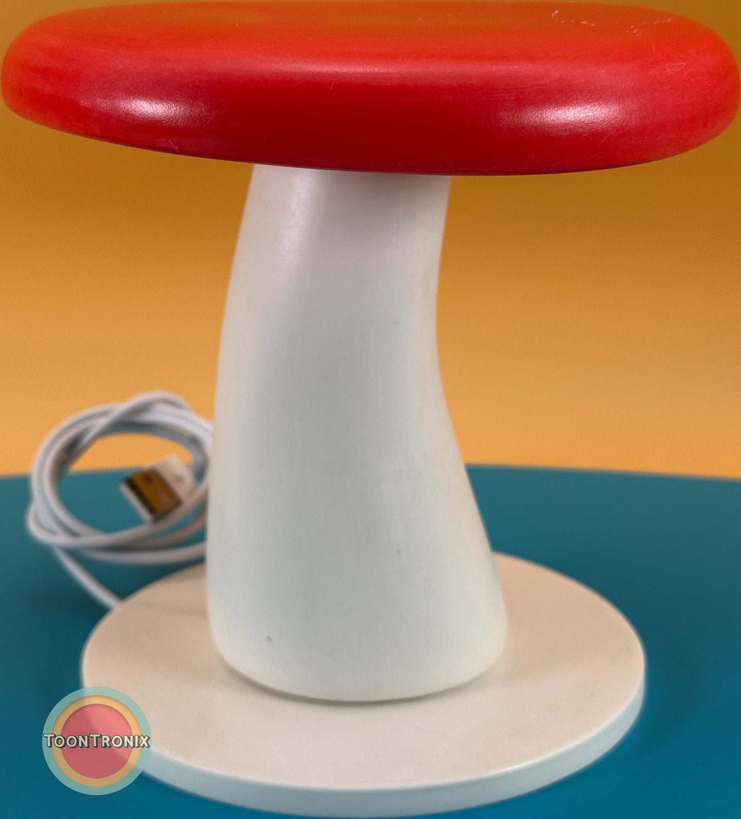 6" or 9" mushroom-shaped desk lamp with red cap and white stem, featuring built-in USB cord for power, retro cartoon style design