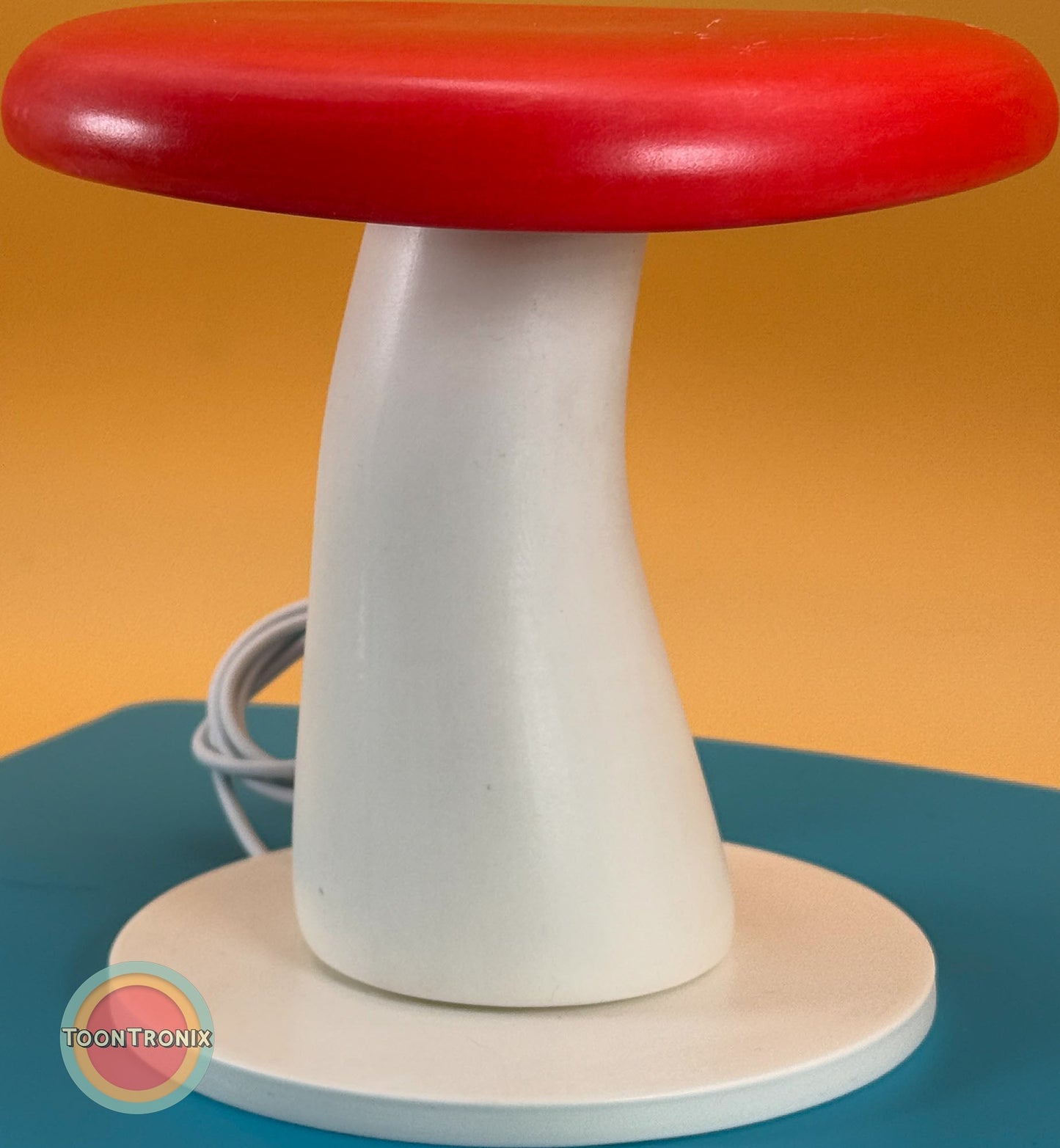 6" or 9" retro-style red and white mushroom desk lamp with built-in USB cord on teal surface