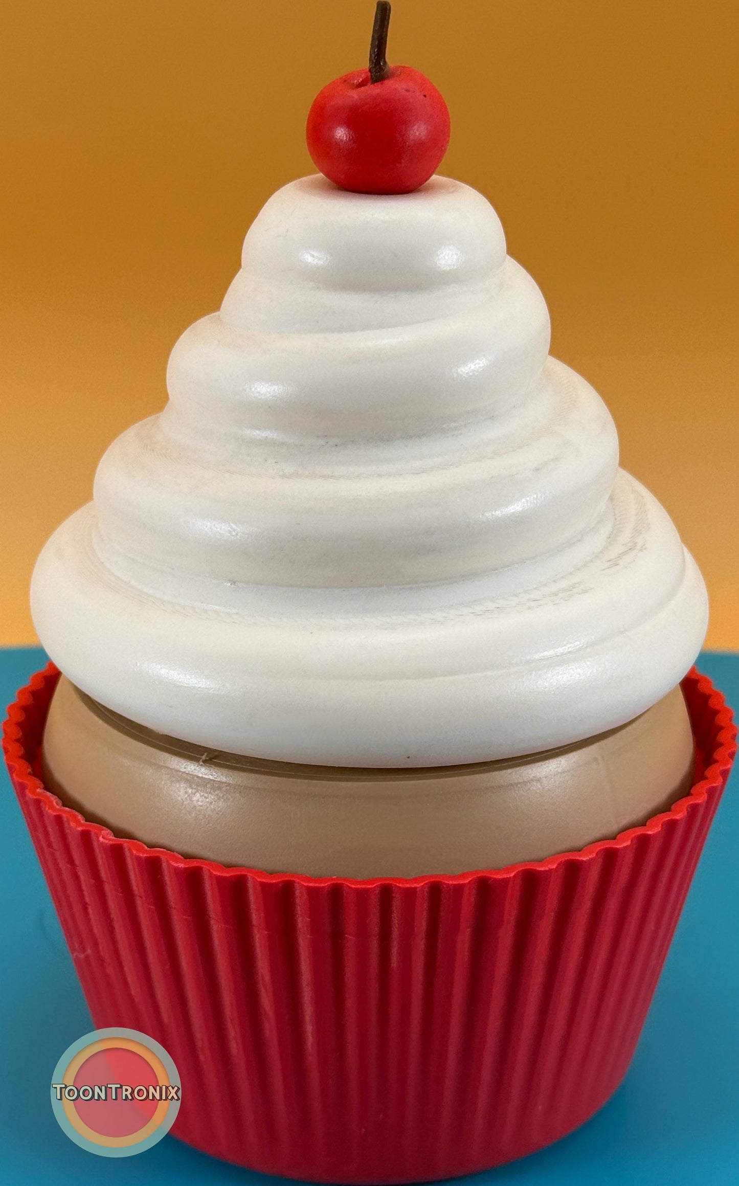 6-inch cupcake desk lamp with white swirl frosting and red base topped with a cherry-shaped detail