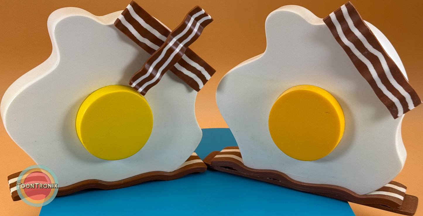Cartoon-style eggs and bacon desk lamp with LED light and built-in USB cord, available in 6 or 9 inches, woodified finish.