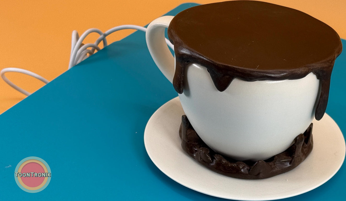 6 or 9 inch coffee desk lamp shaped like a white coffee cup with dark brown liquid design and matching saucer on blue and orange background