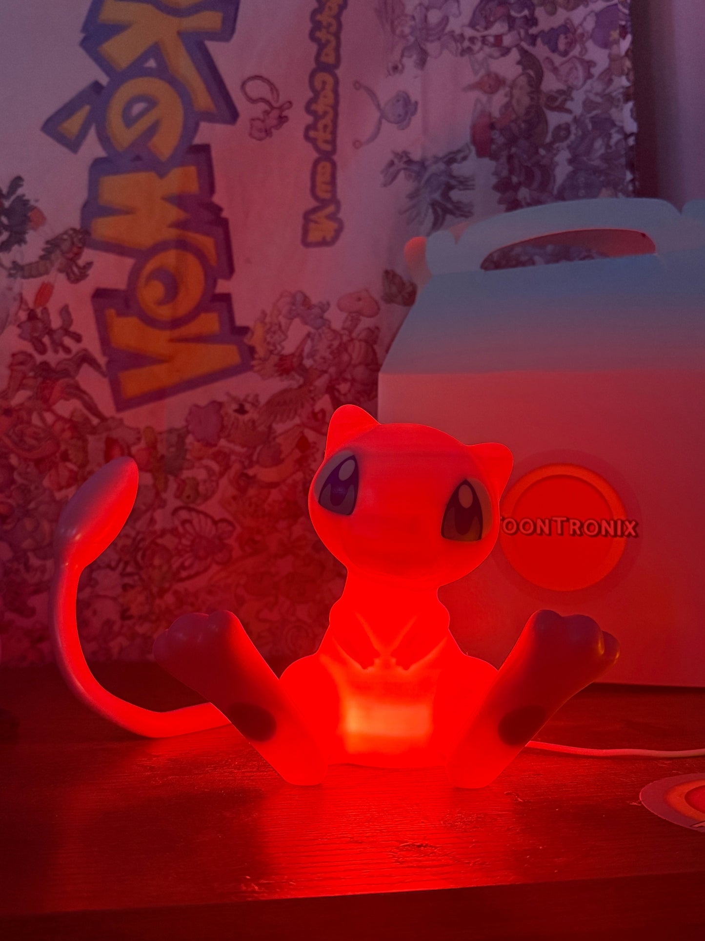 6" tall glowing red Mew Pokemon statue USB desk lamp with wood-like finish and built-in USB cord
