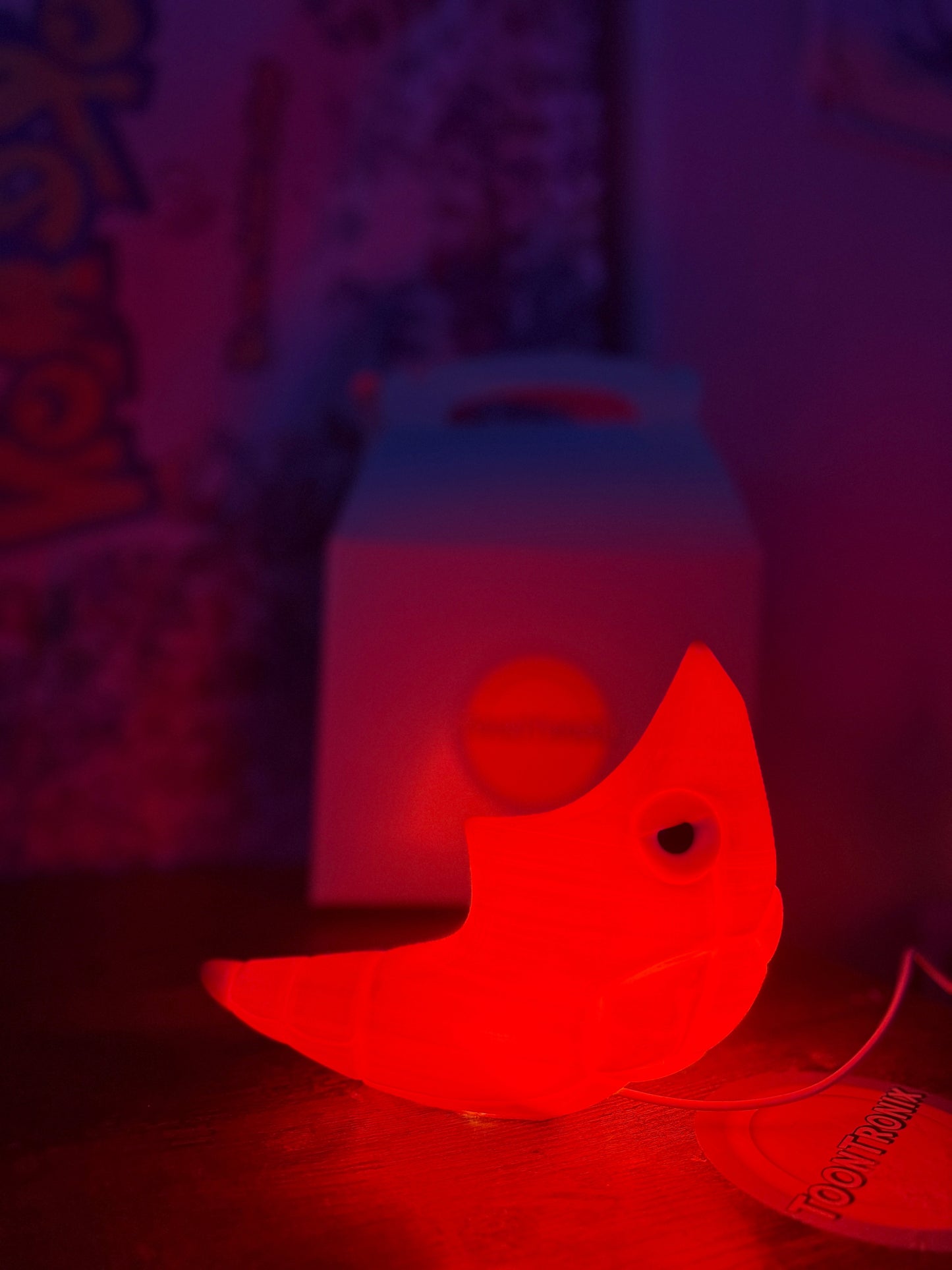 6" Shiny Metapod USB desk lamp glowing red with wood-like finish