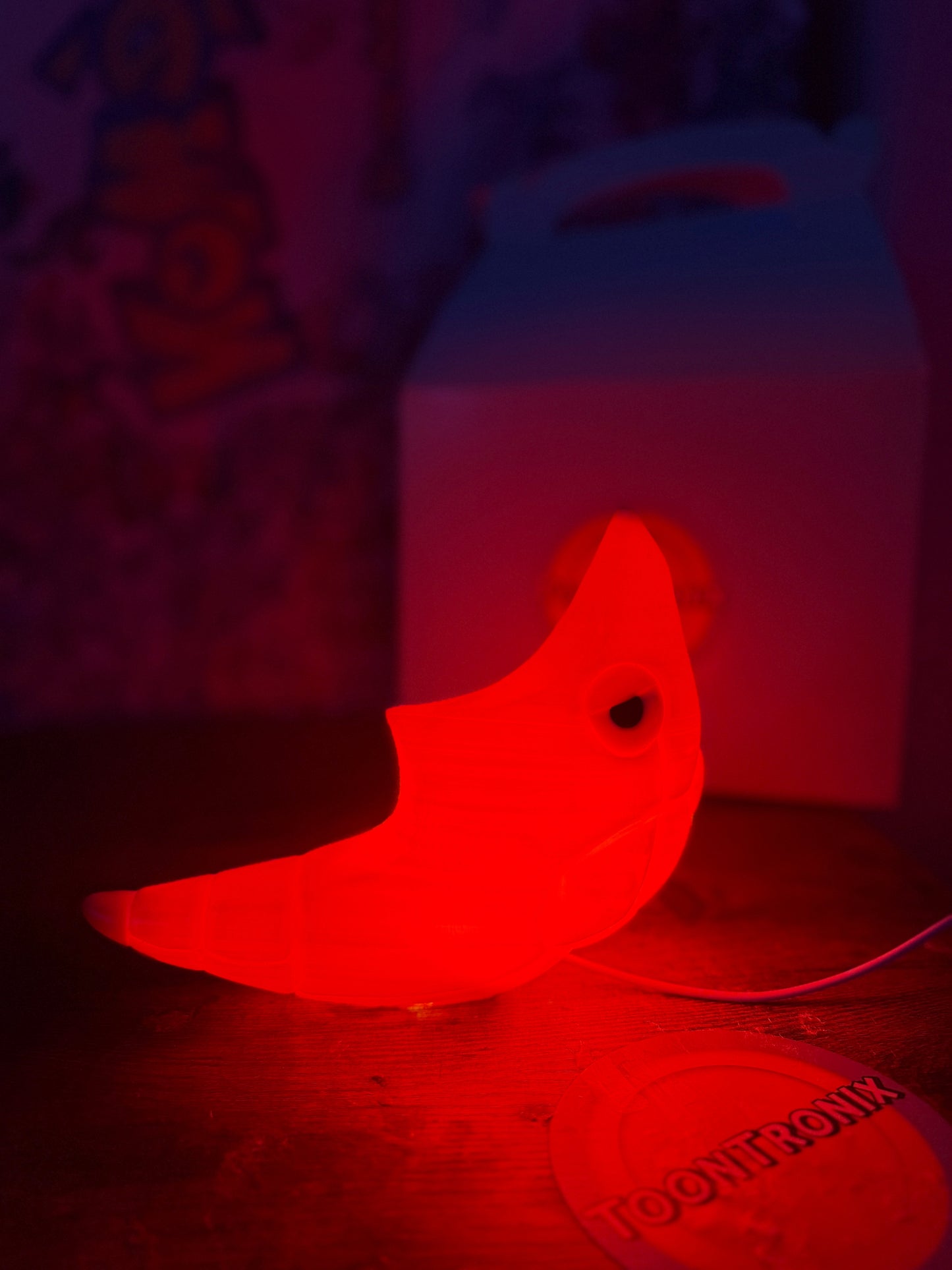 6" tall Shiny Metapod USB desk lamp glowing red with wood-like finish