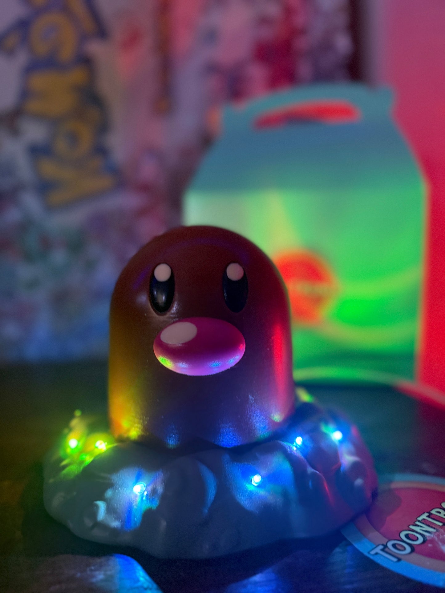 6" tall Diglett Pokemon LED desk lamp figure with USB cord and wood-like finish illuminated by colorful lights