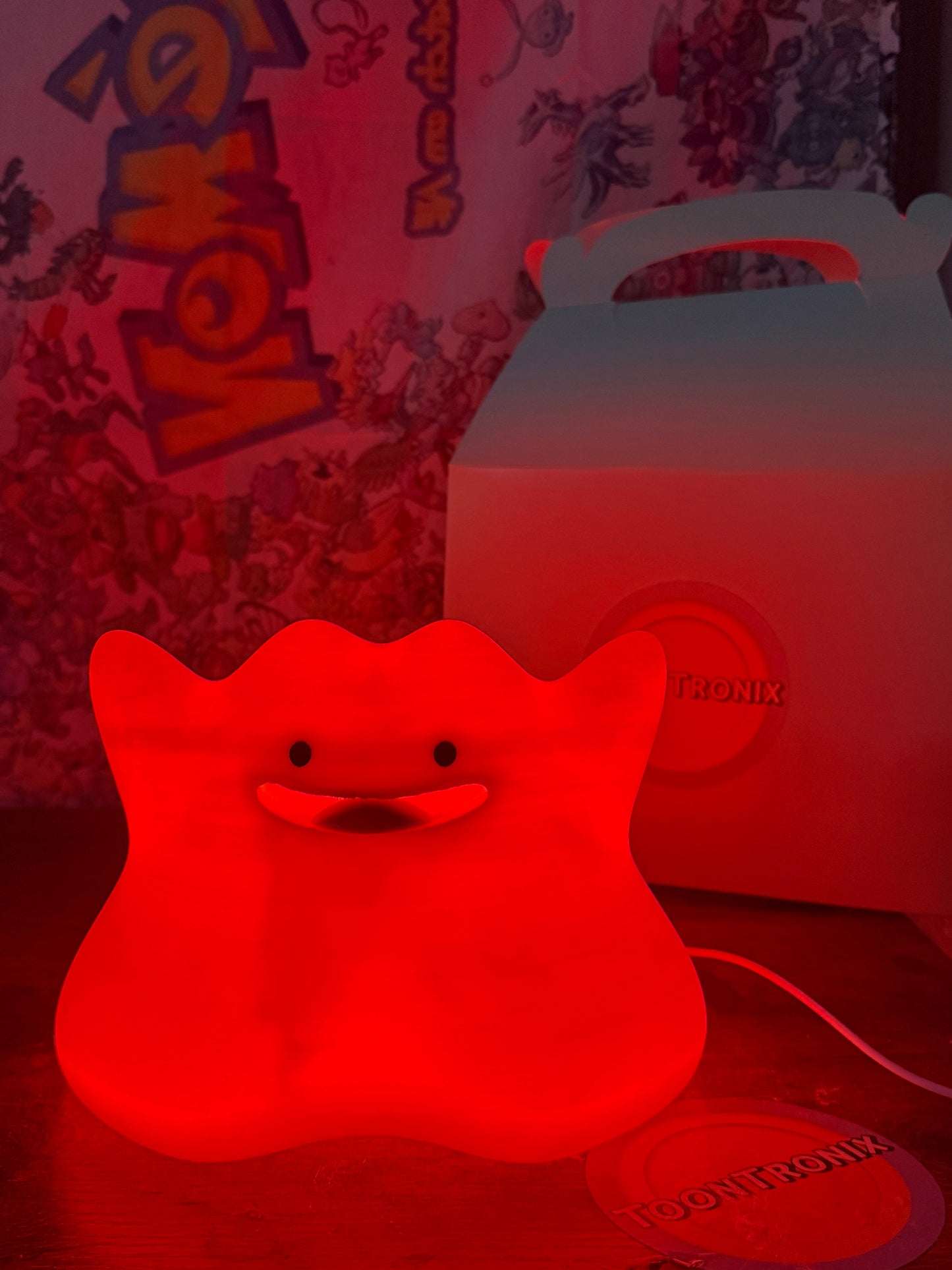 6" Ditto Pokemon statue desk lamp glowing red with USB cord and packaging box in background