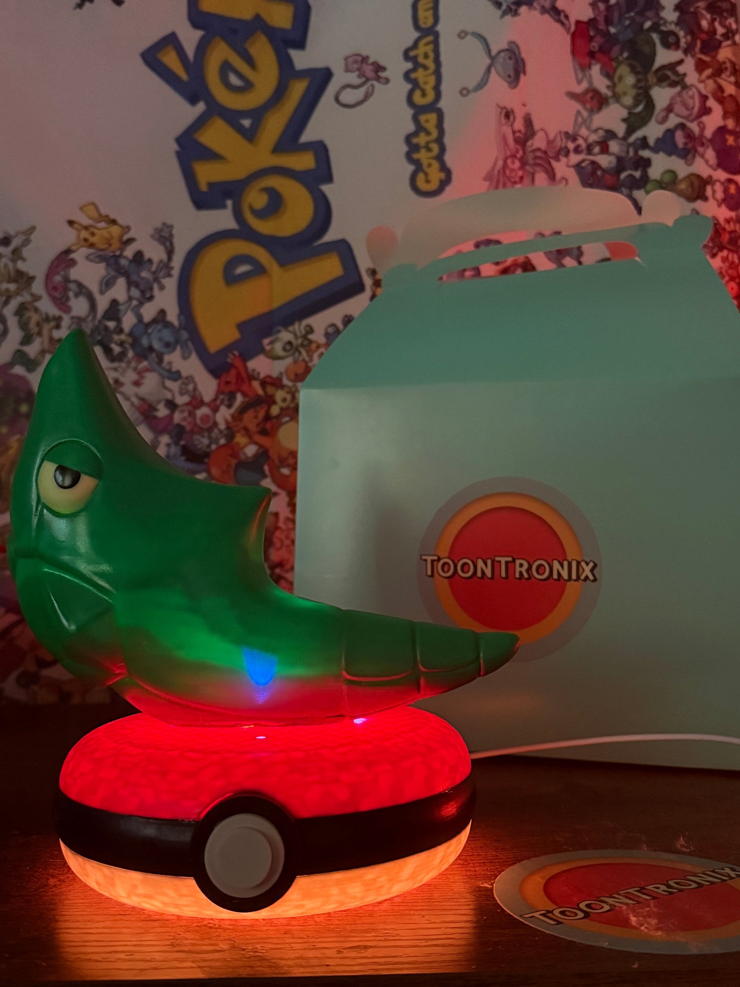 8" Metapod Pokemon Statue LED desk lamp with USB, wood-like finish, glowing Pokeball base, and Toontronix branding