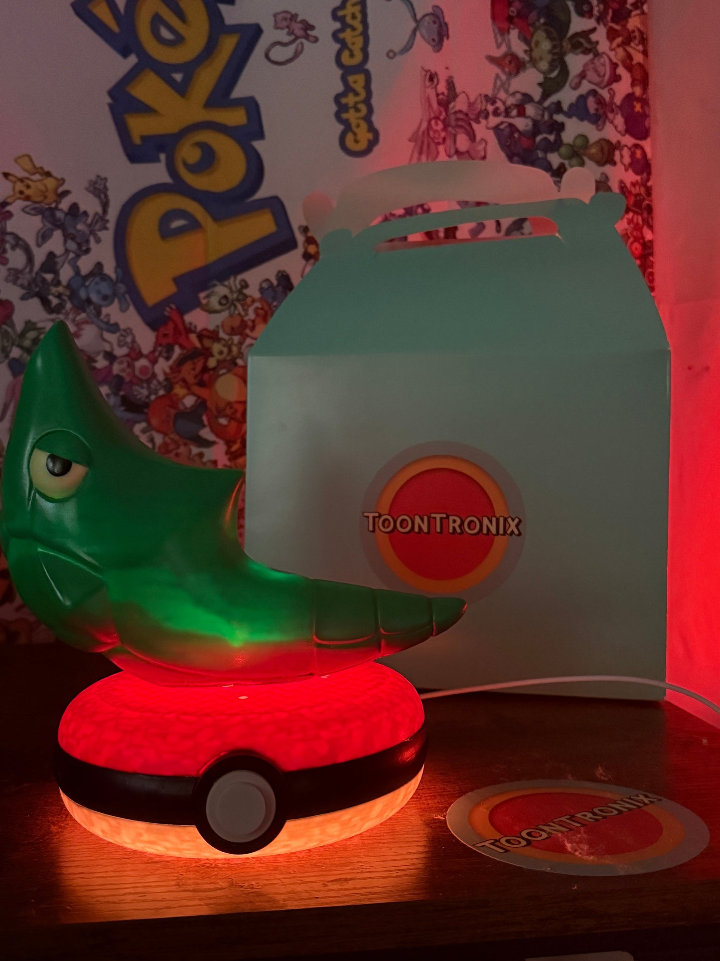 8" Metapod Pokemon statue desk lamp with USB cord on Pokeball base illuminated in red light