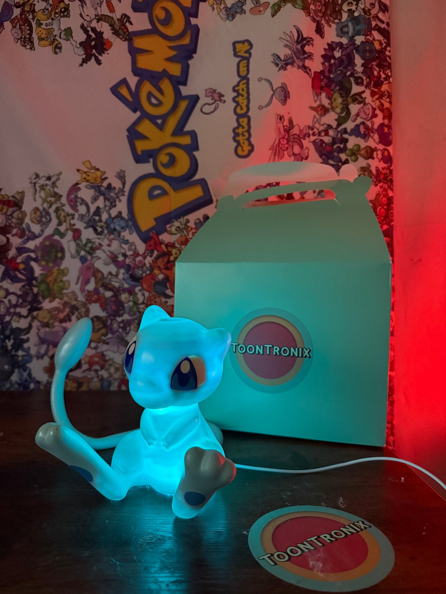 6-inch tall shiny Mew Pokemon LED desk lamp with USB cord and wood-like finish