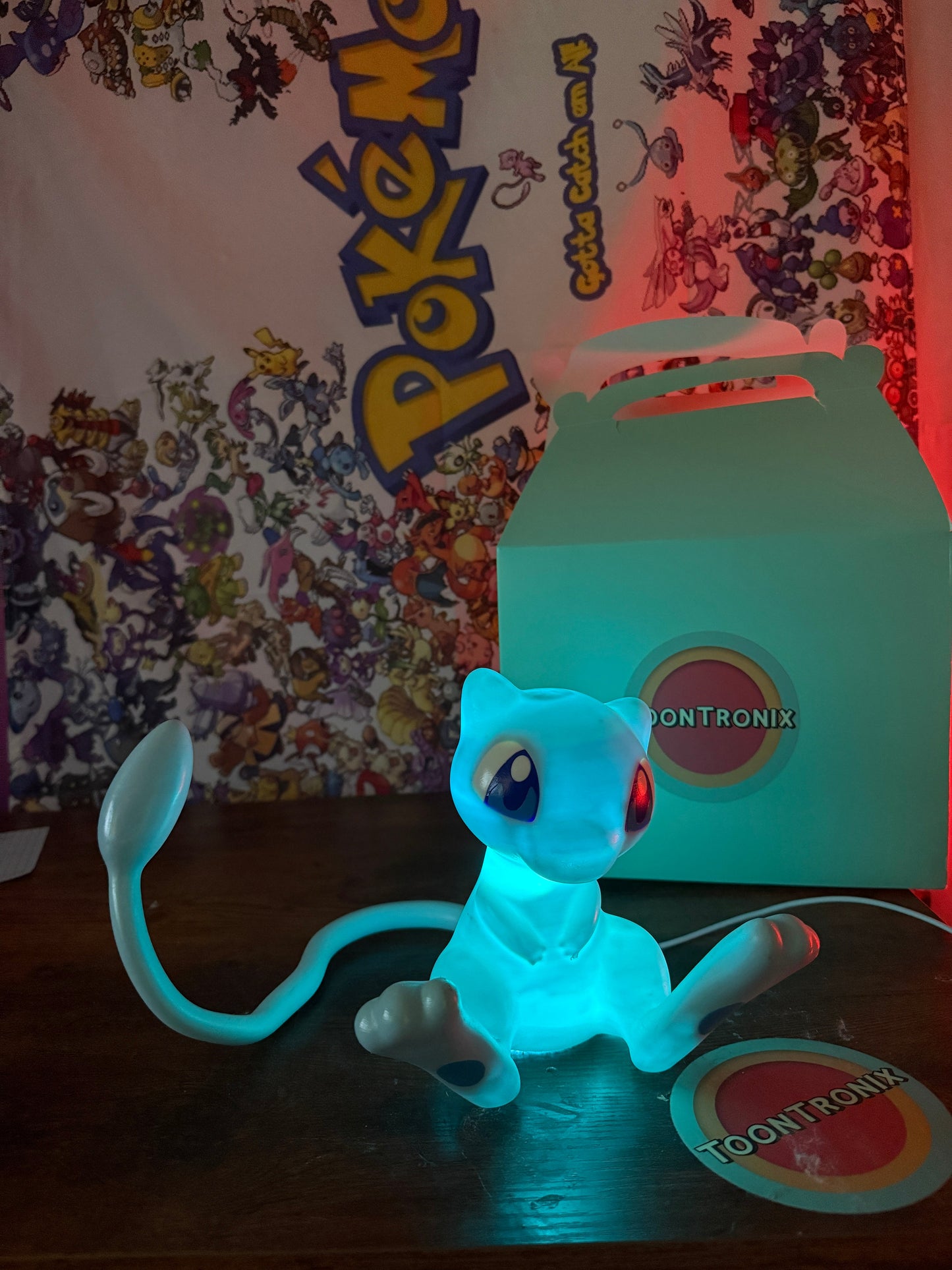 6" tall 11" wide shiny Mew LED desk lamp with USB cord and wood-like finish from Toontronix