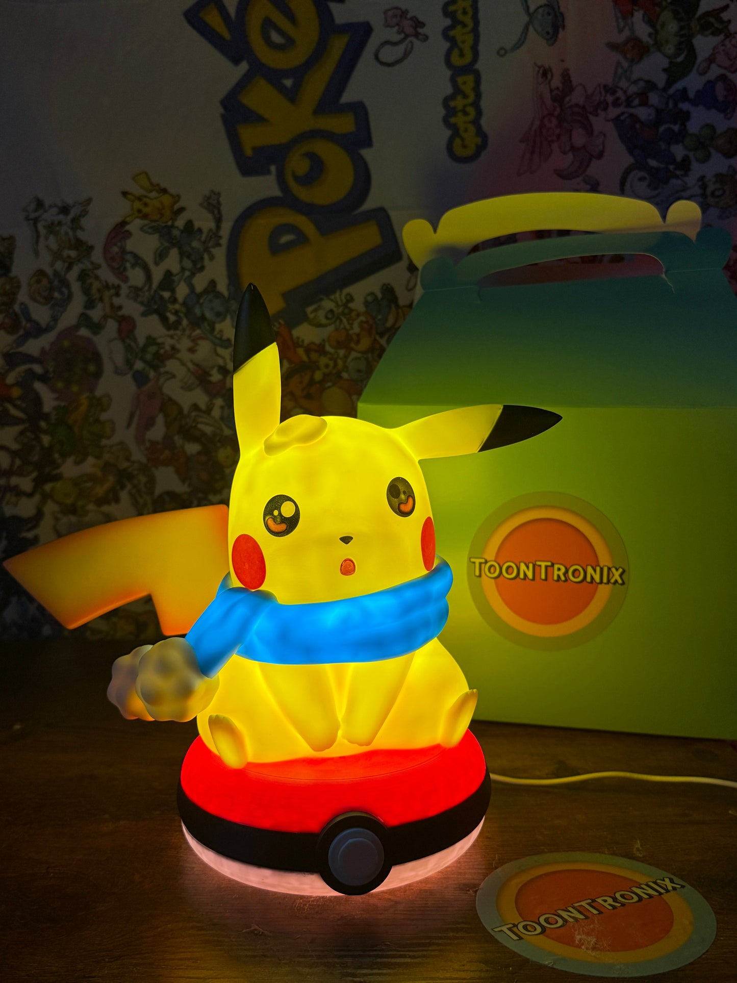 10.5-inch Winter Pikachu Pokeball LED USB desk lamp featuring a glowing Pikachu with a blue scarf on a Pokeball base