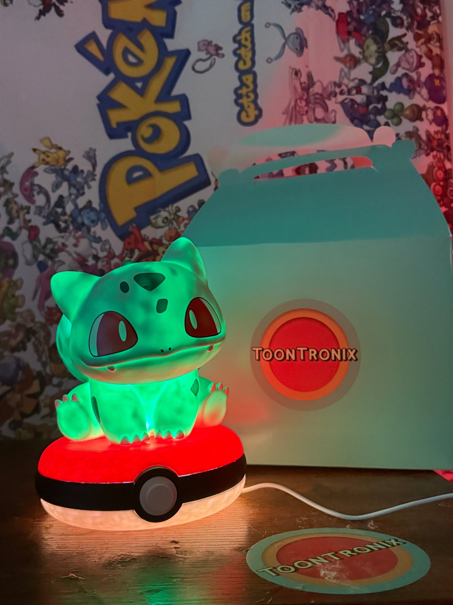 Glowing Bulbasaur Pokeball desk lamp toy figure with built-in USB cord and Toontronix packaging