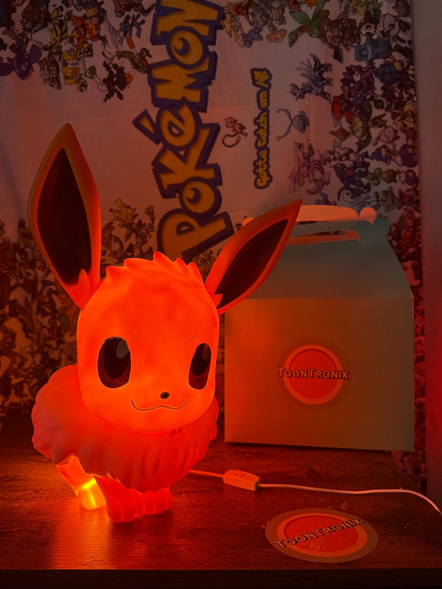 14.5" Eevee Large Statue USB Desk Lamp glowing orange with Pokemon background and Toontronix packaging