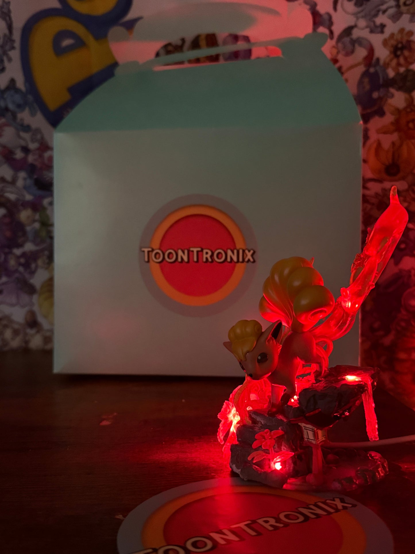 5" Vulpix statue USB LED desk lamp glowing red with Toontronix packaging in background