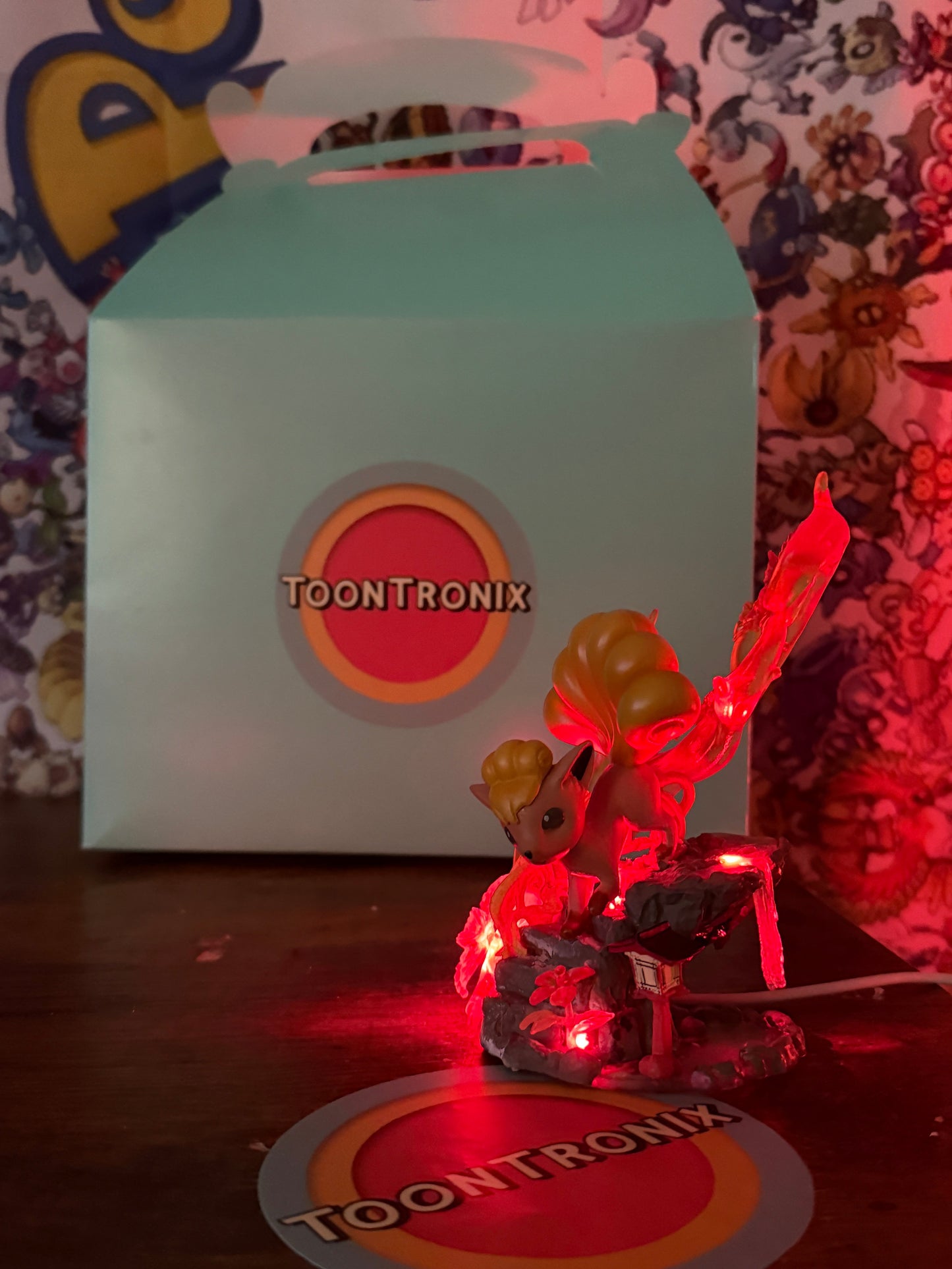 5" Vulpix Statue LED desk lamp with built-in USB cord glowing red with Toontronix packaging in background