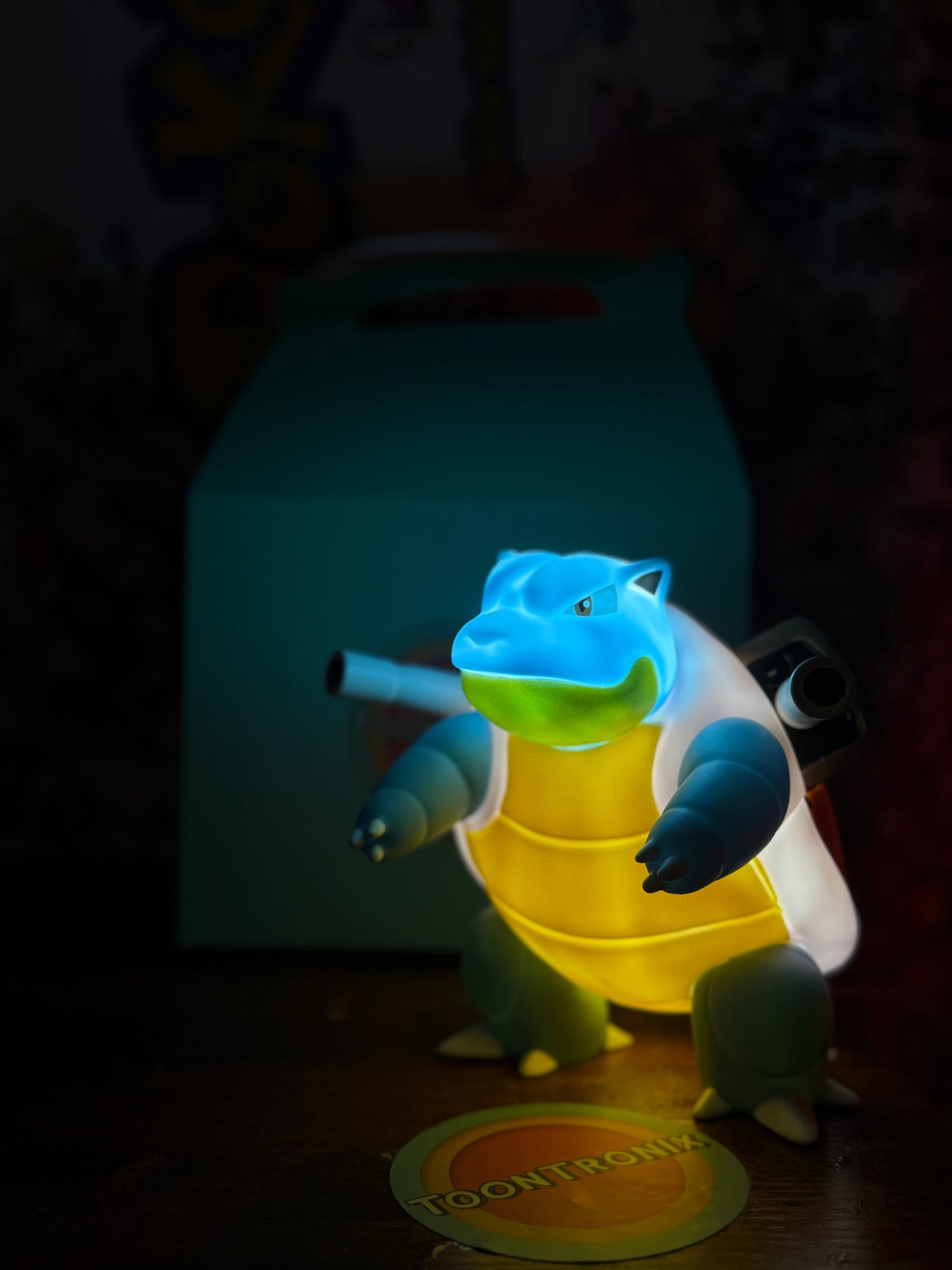 7" Blastoise Statue Pokemon USB LED desk lamp glowing blue and yellow in dark room