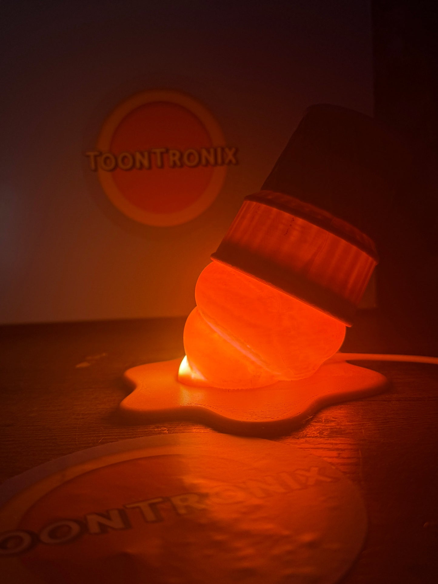 LED ice cream desk lamp with USB power and retro cartoon design glowing orange on wooden surface
