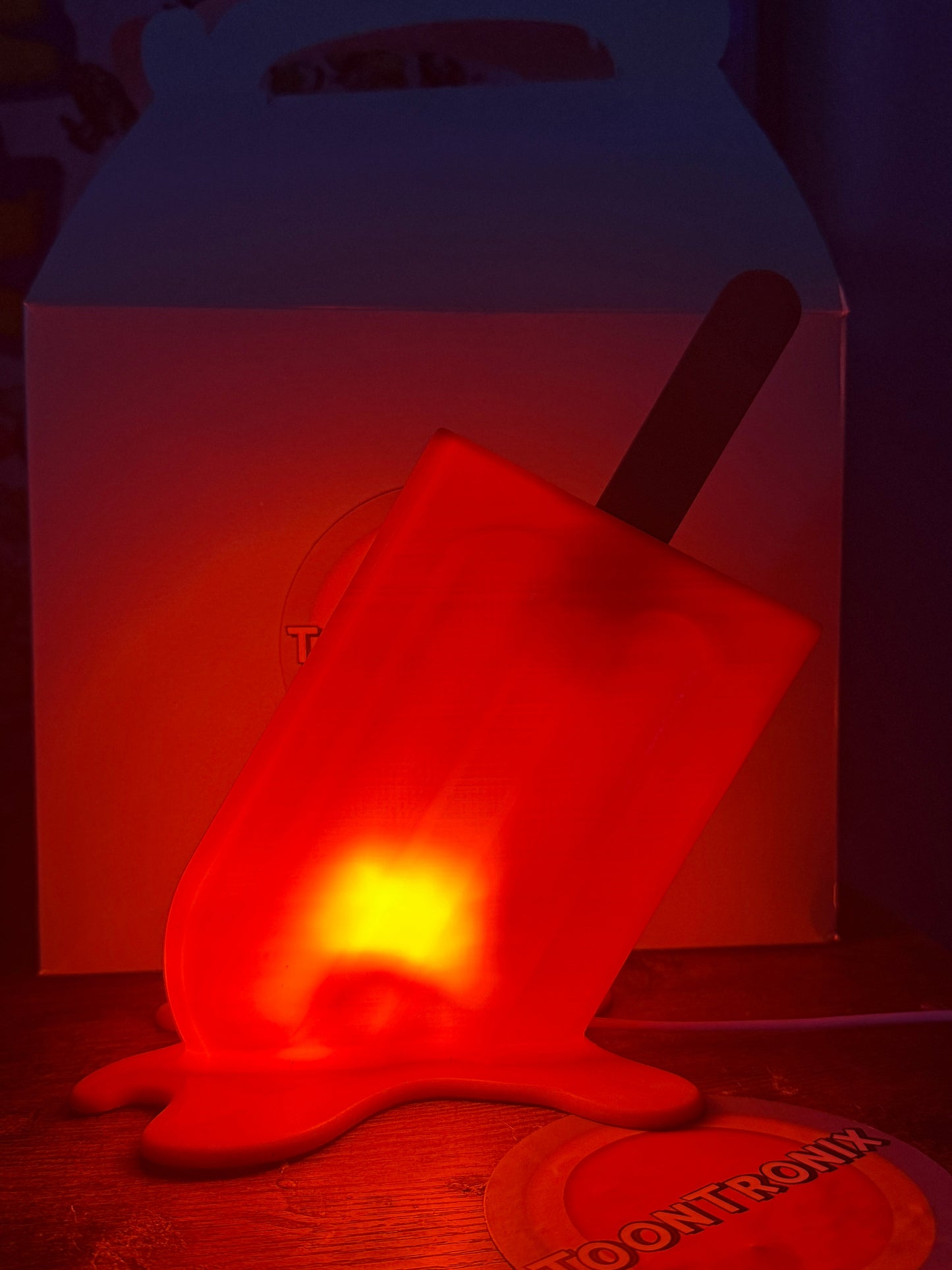 6" or 9" Popsicle-shaped LED USB desk lamp glowing red with melted design and wood-like finish
