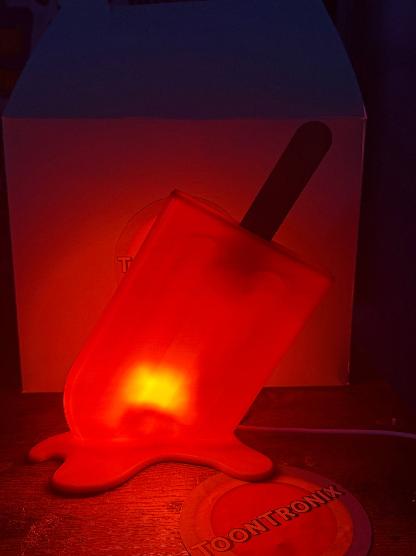 Red glowing 6-inch popsicle shaped LED desk lamp with USB power and retro cartoon design