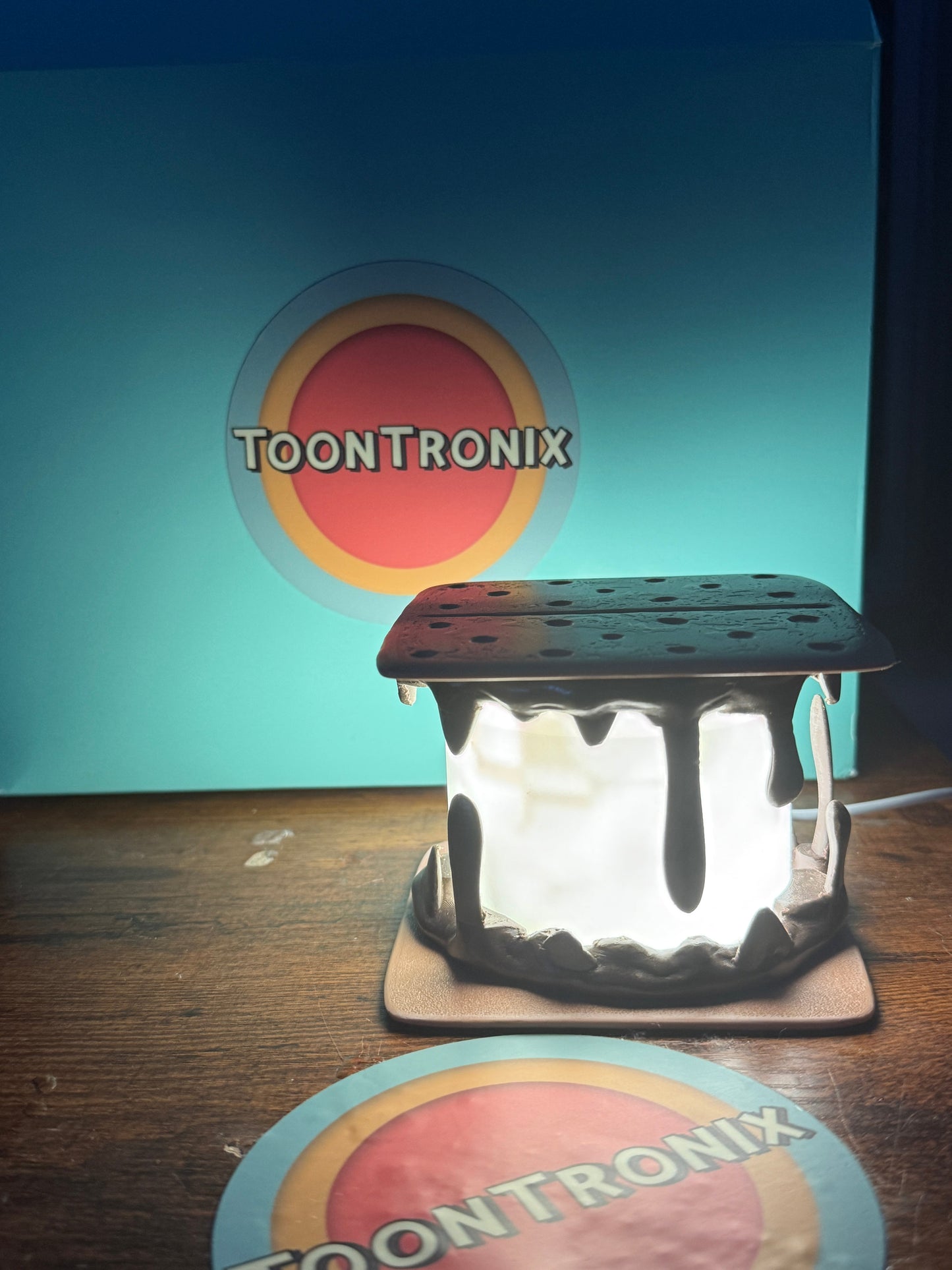 Illuminated Smores Desk Lamp USB toy figure with cartoon decor on wooden surface