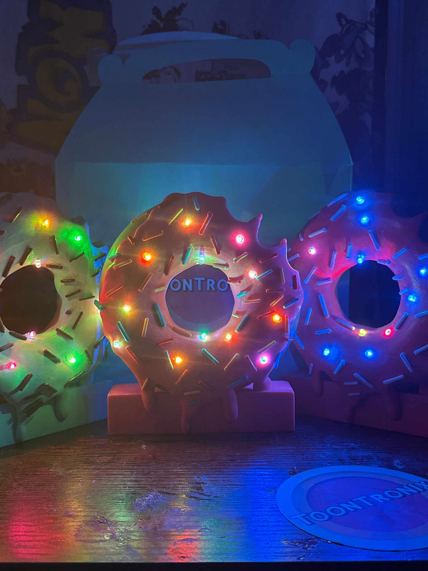 LED desk lamp shaped like a 6" or 9" donut with colorful sprinkles and built-in USB light