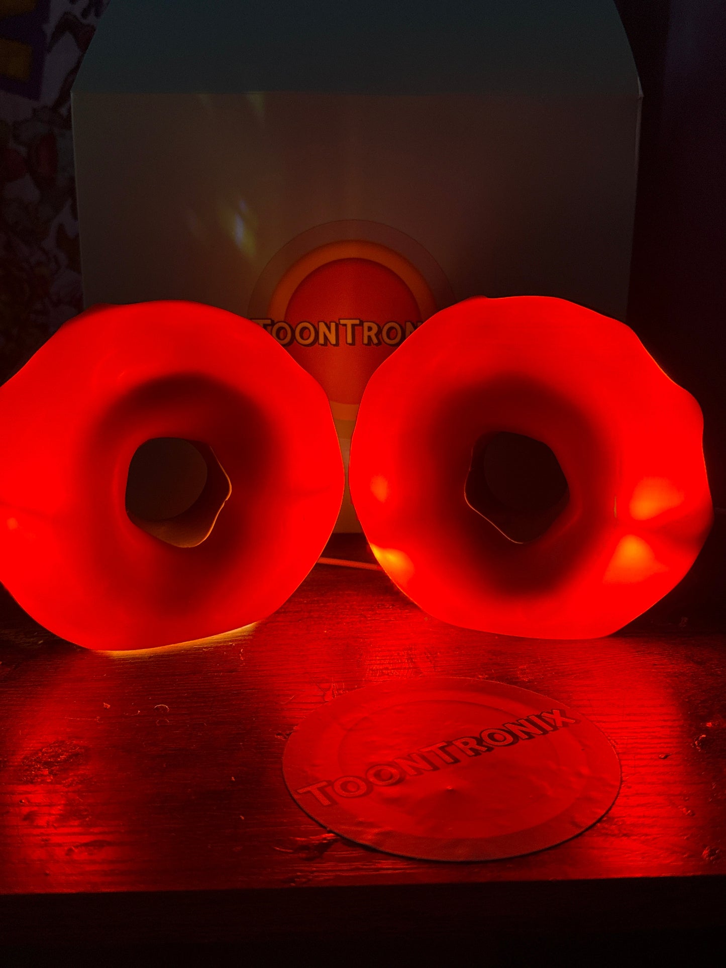 Red glowing 6-inch and 9-inch donut desk lamp with built-in USB cord and wood-like finish