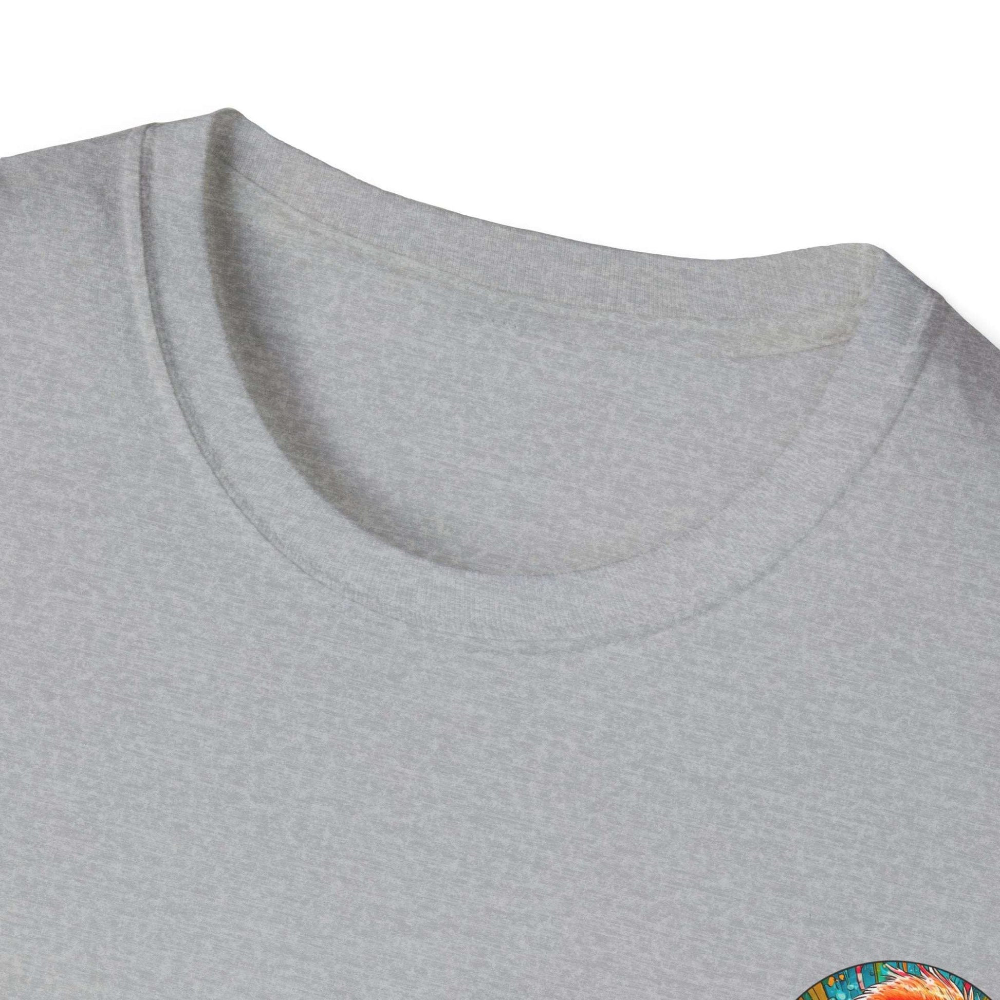 Vibrant Flamingo T-Shirt with ribbed collar on grey fabric, featuring a colorful design.