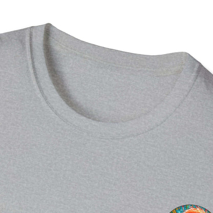 Vibrant Flamingo T-Shirt with ribbed collar on grey fabric, featuring a colorful design.