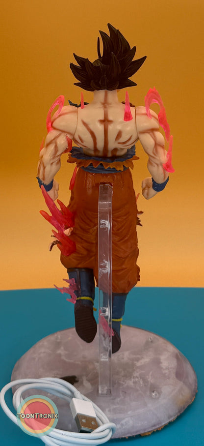 9" Dragonball Z Goku statue USB desk lamp with glowing energy effects and clear stand on a round base