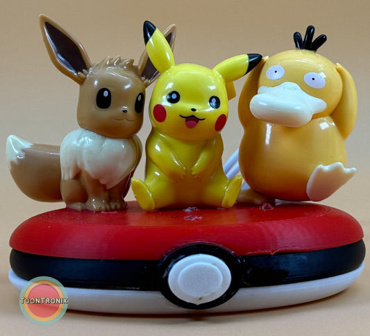3 inch Eevee, Pikachu, and Psyduck Pokemon statue on a Pokeball base USB desk lamp