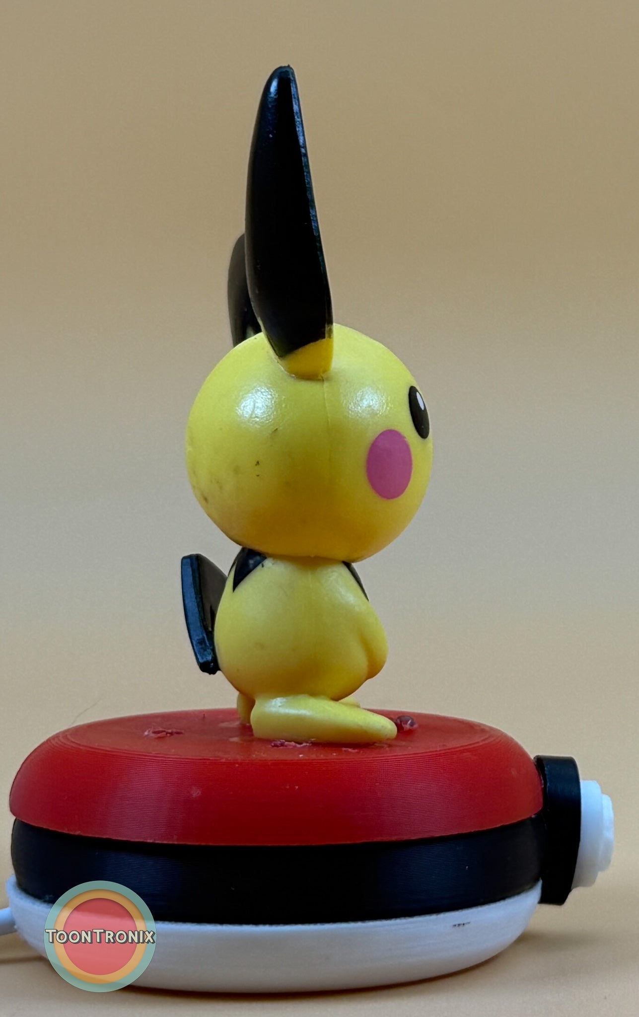 3" Pichu Pokemon statue USB desk lamp with red, black, and white base