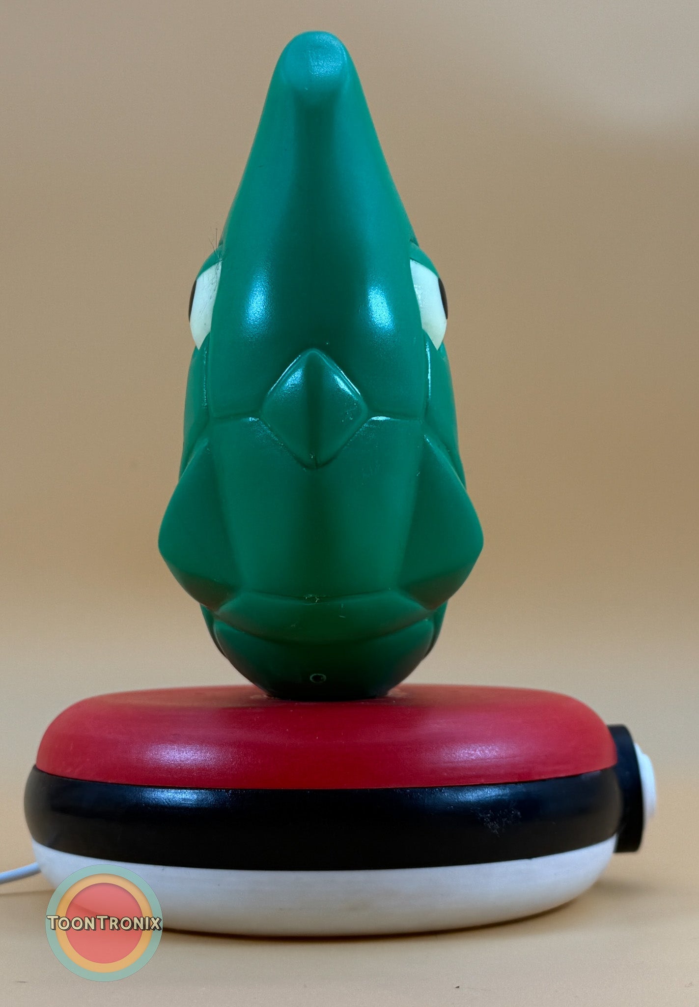 8" Metapod Pokemon statue USB desk lamp with wood-like finish on a Pokeball base