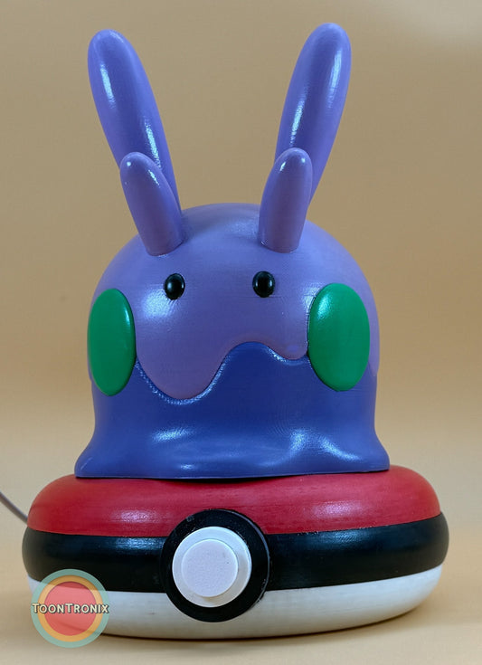 8" Goomy Pokemon statue desk lamp with USB cord and wood-like finish on a Pokeball base