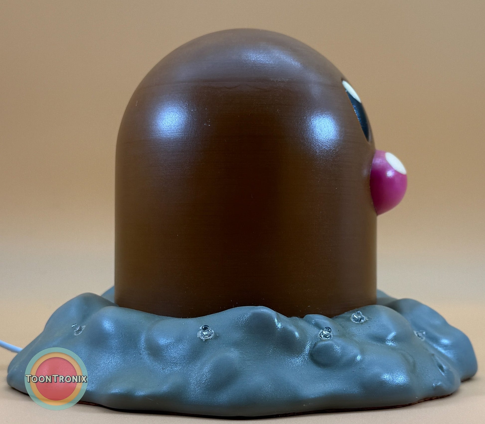 6" tall Diglett Pokemon statue desk lamp with USB cord and wood-like finish sitting on grey textured base