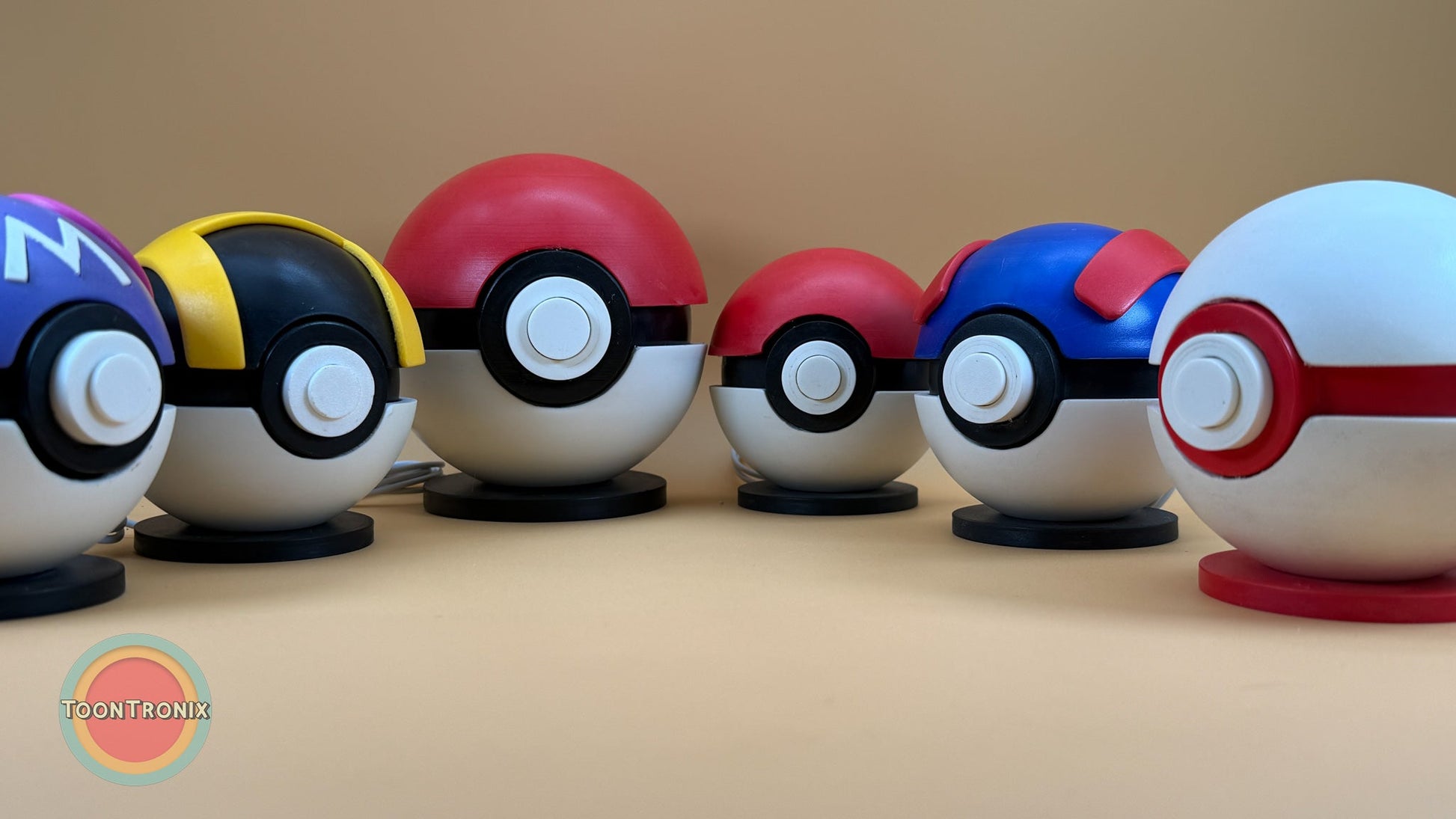 Set of 4.5" and 5.8" Pokeball, Premier Ball, Master Ball, Ultra Ball, and Great Ball USB desk lamps with wood-like finish