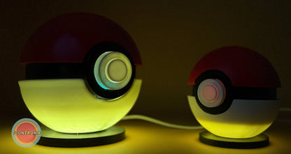 4.5" and 5.8" Pokeball Premier Ball USB desk lamps with wood-like finish glowing in dark