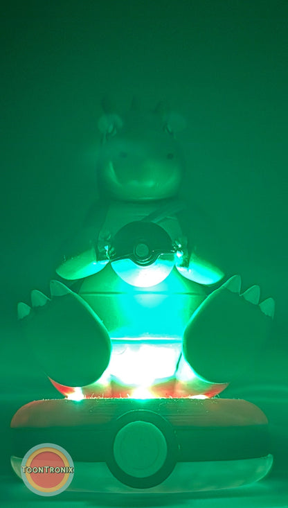 5" Dragonite Pokemon statue USB desk lamp glowing green on a Pokeball base