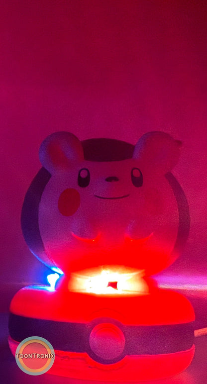 3" Togedemaru Pokemon statue USB desk lamp glowing with red and blue light on a Pokeball base