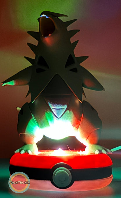 5" Tyranitar desk lamp with built-in USB cord glowing on a Pokeball base