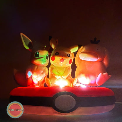 3" Eevee, Pikachu, and Psyduck friends Pokemon statue USB desk lamp glowing on a Pokeball base