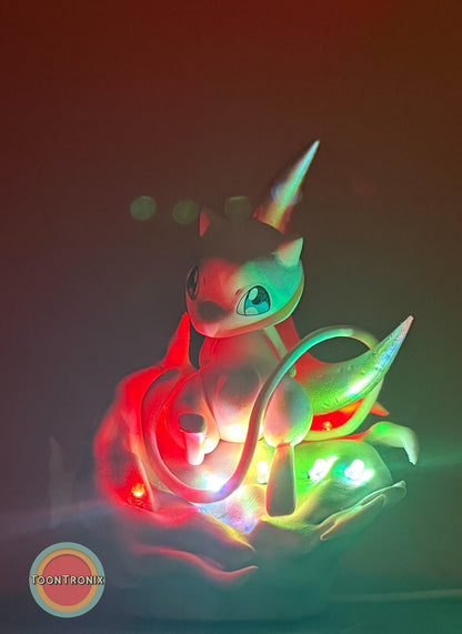 5" Mew Pokémon statue USB desk lamp glowing with colorful lights on a dark background