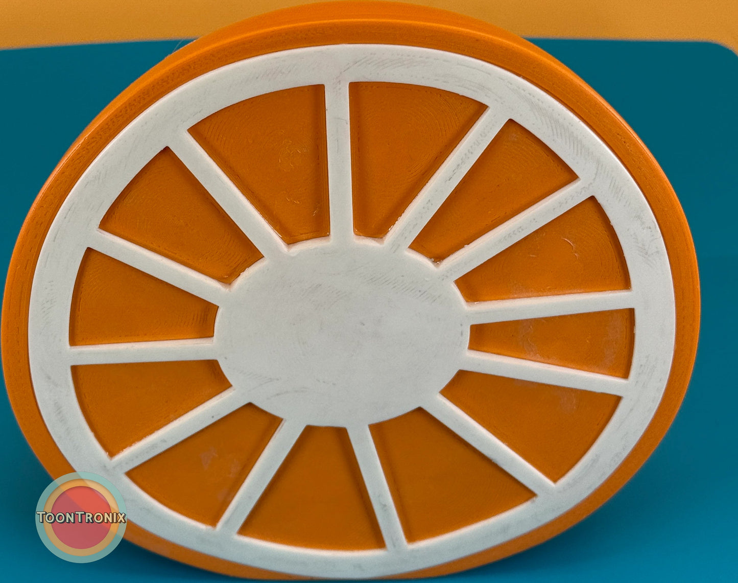 Top view of a 6" or 9" orange desk food lamp shaped like an orange slice with wood-like finish and built-in USB cord.