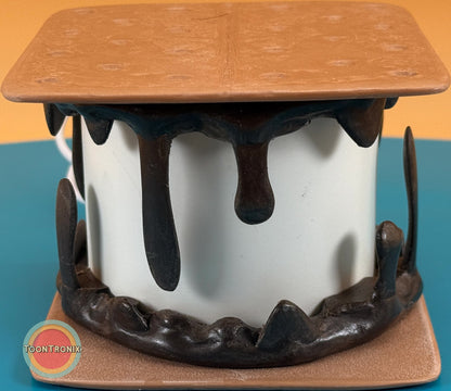 Retro cartoon style smores desk lamp with melting chocolate and toasted marshmallow design on a blue background